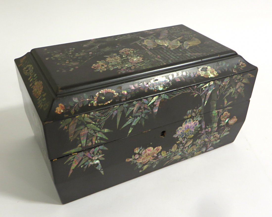 Nacre And Lacquer Decorated Box: A black and painted box with nacre or mother of pearl inlay. Shipping: We are able to pack and ship this item to an address in the United States for $40.00 via USPS Priority Mail or via FedEx Ground/H