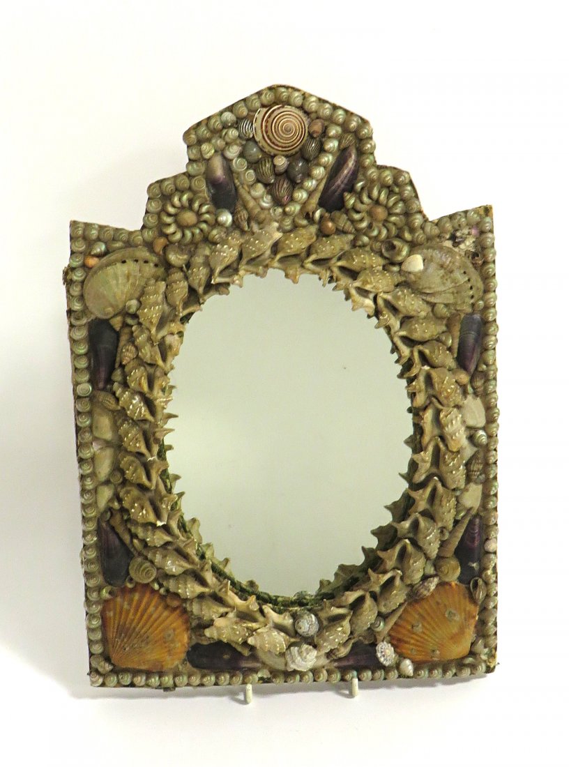 Sailor's Shell Decorated Frame: A late 19th century sailor frame hand made, being constructed from various shells. Now with a removable mirror which could be used as a photo frame. Shipping: We are able to pack and ship this item to