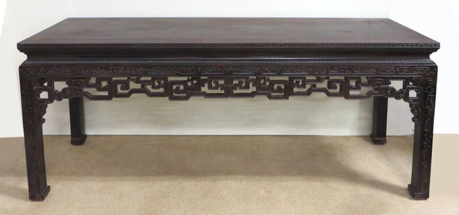 Rare And Large Carved Chinese Zitan Table: A rare Qing Dynasty Zitan wood table with carved squared legs carved in the Chinese fashion and a pierced skirt with the cloud and lotus design. 70 1/2" X 21 1/2" X 32"Shipping: We are unable to ship