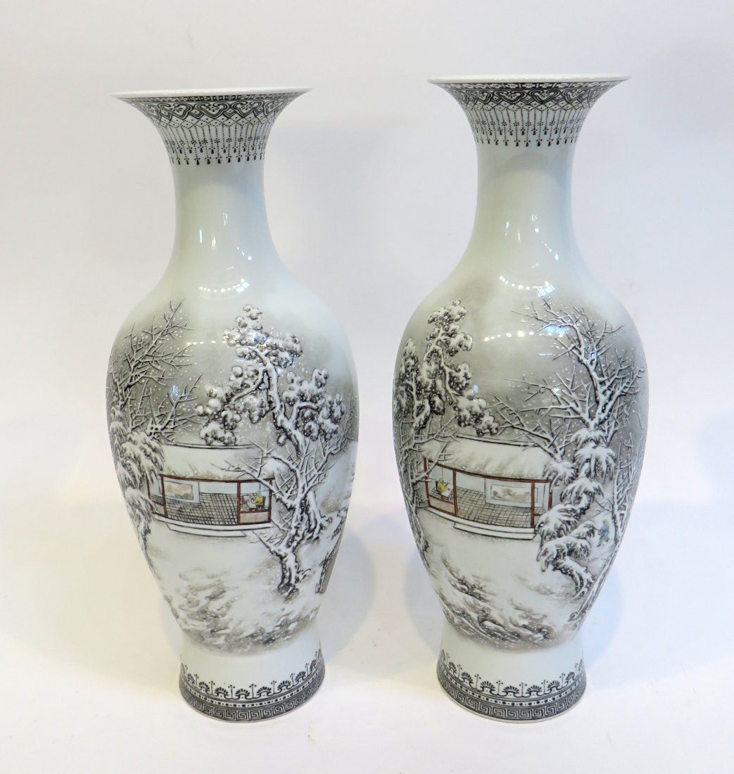 Garniture Vases: A pair of porcelain vases in the baluster form with white/ grey snow scenes. Each 10 1/2". Shipping: We are able to pack and ship this item to an address in the United States for $55.00 via USPS Prior