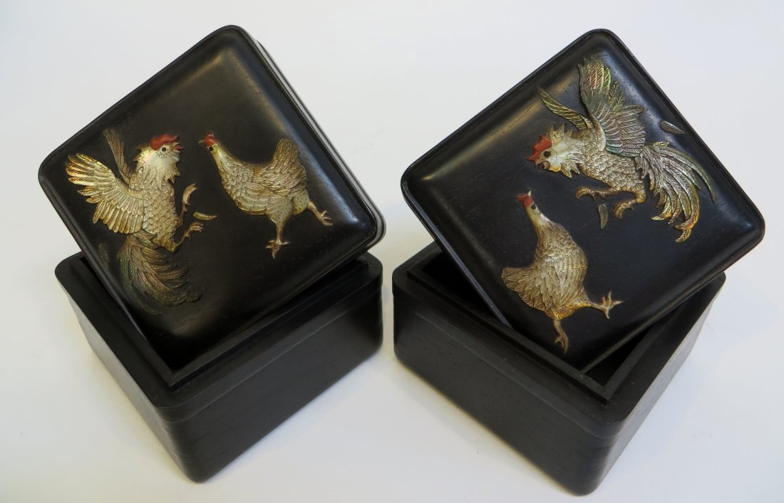 Pair Of Zitan Boxes: A pair of hand made lidded boxes, each 3 1/2" square, in dark dense hardwood, featuring nacre cut cock fight scenes, the latter done in meticulous detail. Shipping: We are able to pack and ship this i