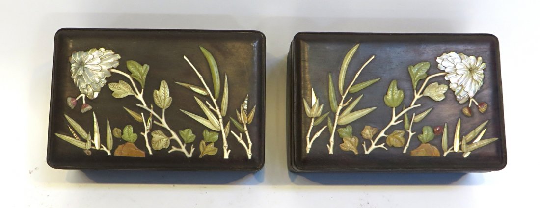 Pair Of Zitan Boxes: The tops decorated with nacre, and carved hardstones of rosewood or Zitan Hardstone and mother of pearl. About 7" X 5" X 3" Shipping: We are able to pack and ship this item to an address in the United