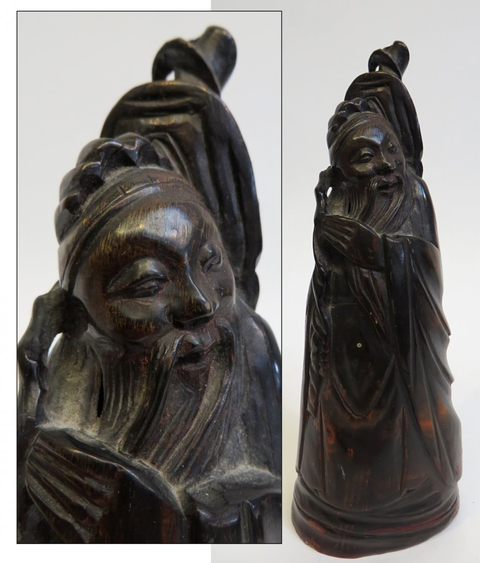 Asian Carved Horn: A 7 1/4" carved horn of a wise man with a dark red stain. Shipping: We are able to pack and ship this item to an address in the United States for $40.00 via USPS Priority Mail or via FedEx Ground/Home