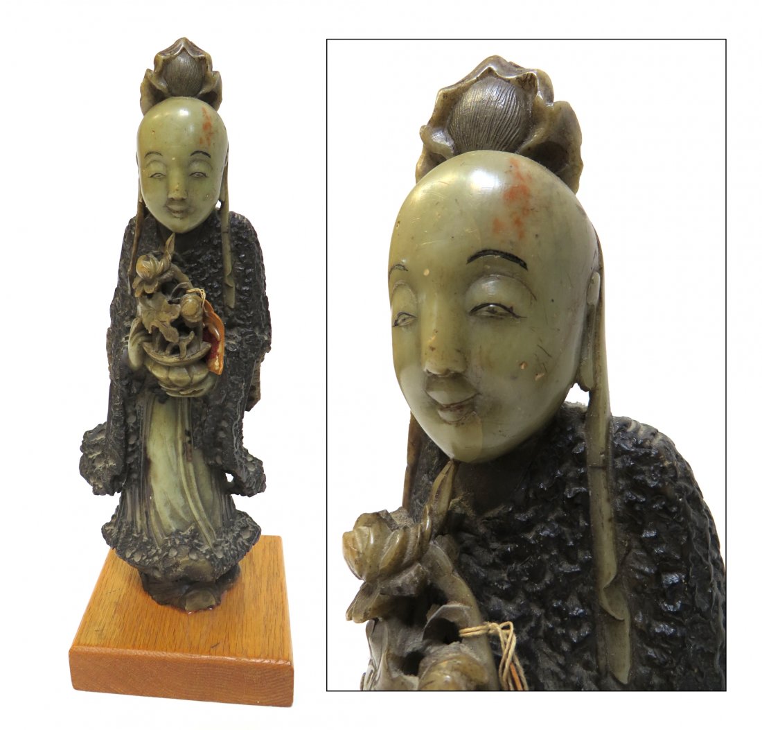Soapstone Quan Yin: A soapstone and painted carving mounted onto a later wood stand, 12 1/4" in height. Shipping: We are able to pack and ship this item to an address in the United States for $50.00 via USPS Priority Mai