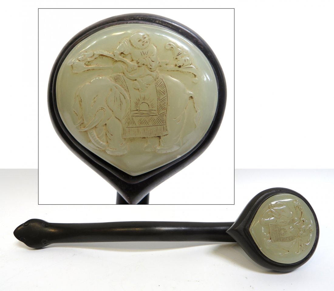 Jade & Zitan Ruyi: A 14" ruyi in Zitan wood, with a single circular shaped carved white jade cartouche with a man on an elephant. Shipping: We are able to pack and ship this item to an address in the United States for $