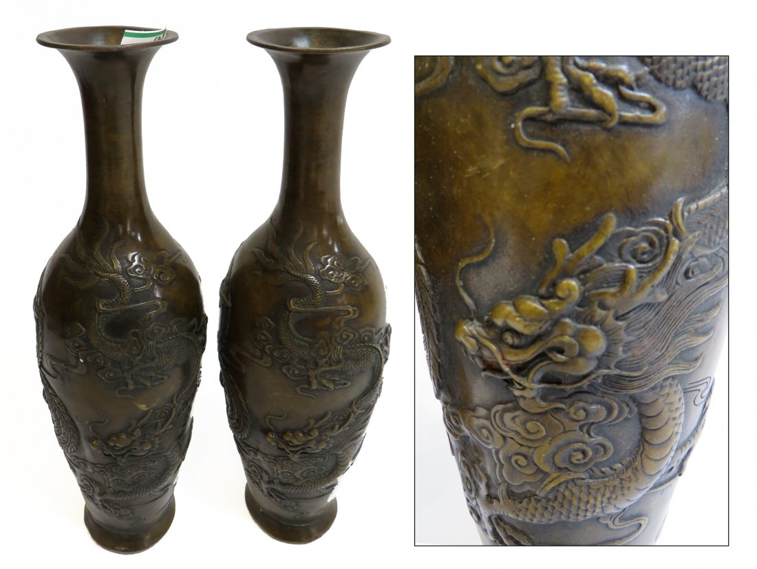 Pair Of Bronze Garnitures: A pair 11" bronze garnitures with embossed marks at the bottom and base relief dragons swirling before Phoenix birds. Shipping: We are able to pack and ship this item to an address in the United State