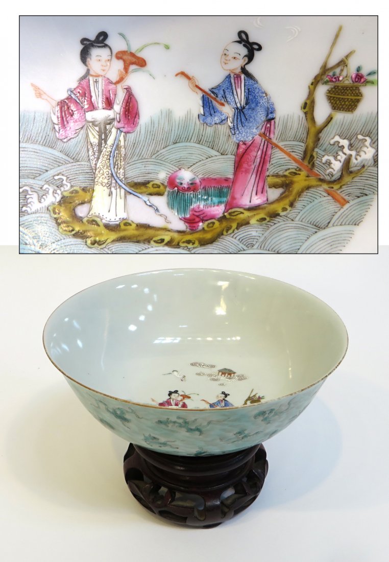 Chinese Porcelain Bowl: A 6 1/2" bowl with a fine interior scene of a couple on a riverboat whose exterior, in verte, shows a collection of small animalistic Chimera and creatures. Set on a carved rosewood base. Shipping: We