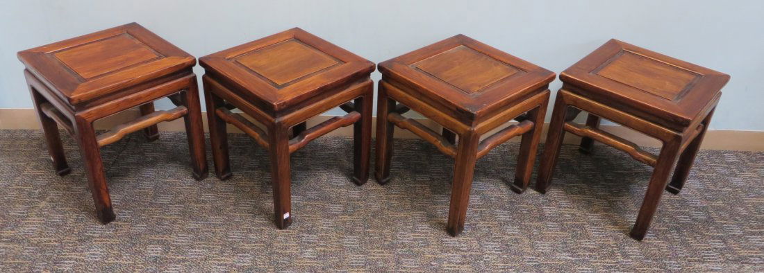 Four Chinese Huanguali Stools: Four square hardwood stools with paneled seats framed in tendon joined borders. Squared legs ending with an inward swirled carving. 17 1/2" X 15" X 15" Shipping: We are unable to ship this item. Pleas