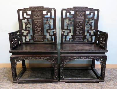 Zitan Wood Arm Chairs: Two 19th century highly carved armchairs featuring assembled armrests and backrest Shipping: We are unable to ship this item. Please contact our local UPS Store, store1152@theupsstore.com, or the Pack