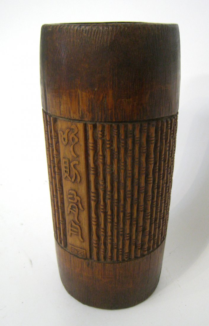 Chinese Bamboo Brush Pot: A 9 1/4" with a carefully carved repeating "bamboo" image around and a calligraphic image. Shipping: We are able to pack and ship this item to an address in the United States for $40.00 via USPS Prior