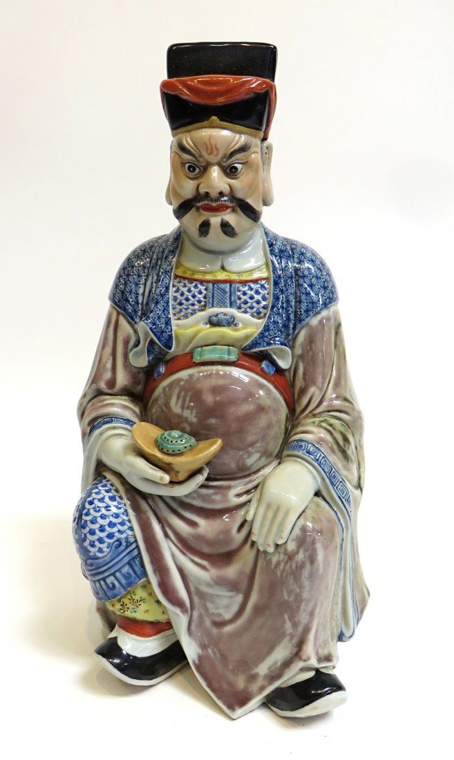 Chinese Porcelain God Figure: A colorfully robed male figure offering incense in seated position. 14" in height with a pierced rectangle on his back, possibly for mounting in a teahouse. Shipping: We are able to pack and ship this