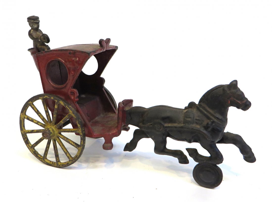 Cast Iron Toy: A cast iron and painted horse drawn coach with the outside detachable driver, Shipping: We are able to pack and ship this item to an address in the United States for $30.00 via USPS Priority Mail. Tra