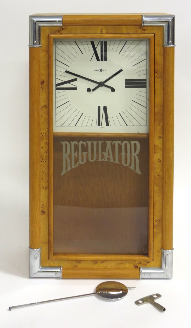 Clock Howard Miller "Regulator": A 20th century designer bird's eye maple cased wall clock by Howard Miller, 25" X 13". Shipping: We are unable to ship this item. Please contact our local UPS Store, store1152@theupsstore.com, or the 