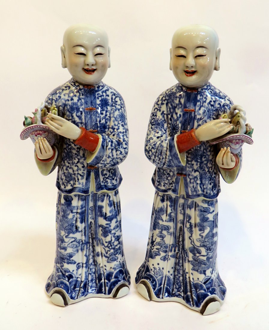 Pair Blue & White Chinese Figures: A pair of happy Chinese men in sumptuous blue and white robes offer you bouquets of fresh Spring flowers. each 17" in height. No marks, but high quality, engaging craftsmanship. Shipping: We are able 