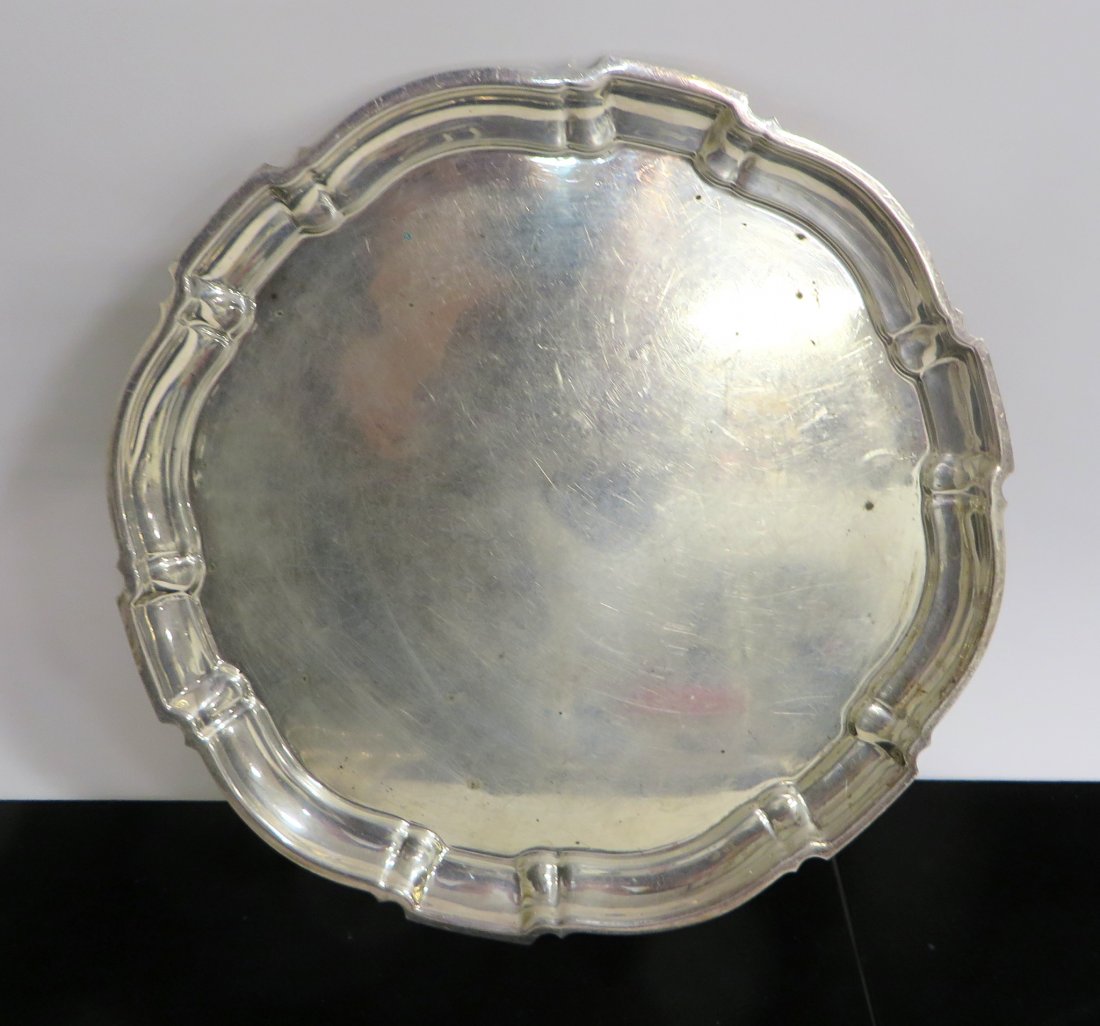 Sterling Chippendale Style Serving Tray: A serving or tea tray, 11 3/4" in diameter, 28 OzT. Shipping: We are able to pack and ship this item to an address in the United States for $40.00 via USPS Priority Mail or via FedEx Ground/Home Deliv