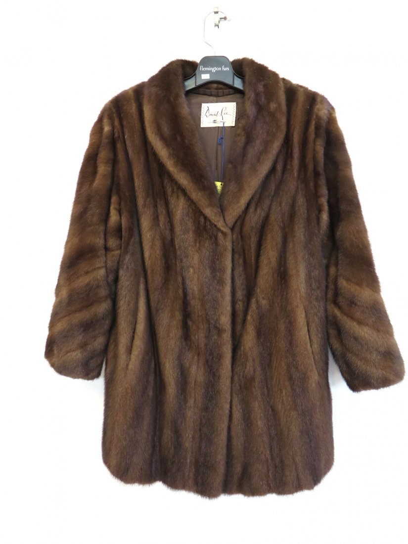 Ladies Mink Coat: Brown in color, in a larger size, with sleeve length being 23 1/2", across the back, 20", entire length 29" Shipping: We are able to pack and ship this item to an address in the United States for $55.