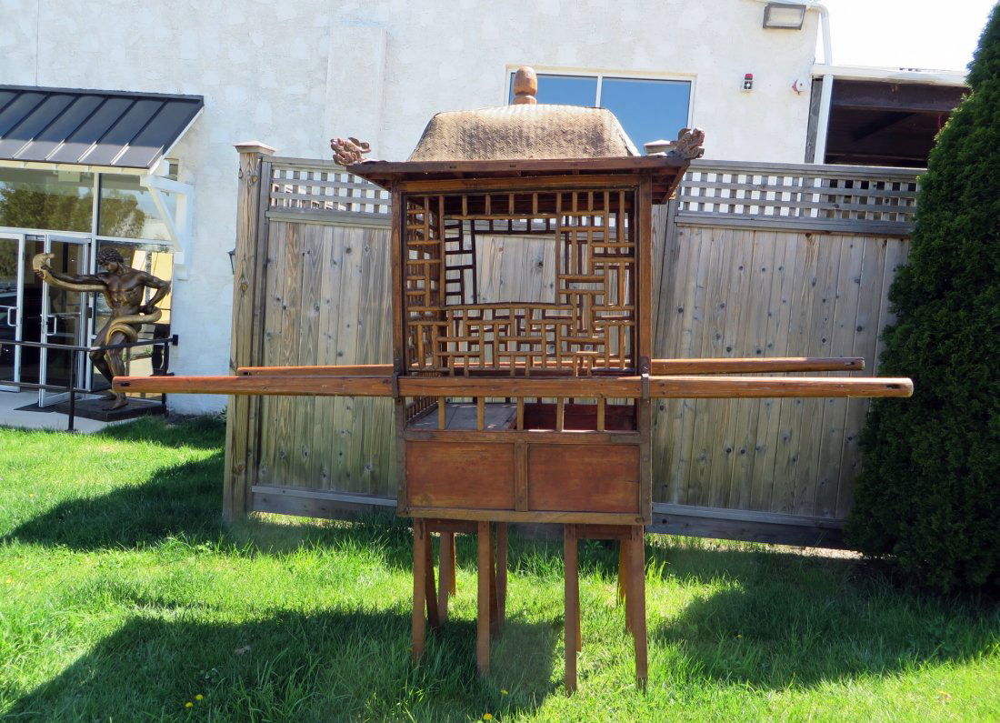 Chinese Sedan Chair or Palanquin: A wood framed antique sedan chair with a bamboo caned pagoda top (damage and wear), a trellis formed sides and a single interior seat. The sedan is 31" X 38", at the base. Shipping: We are unable to s