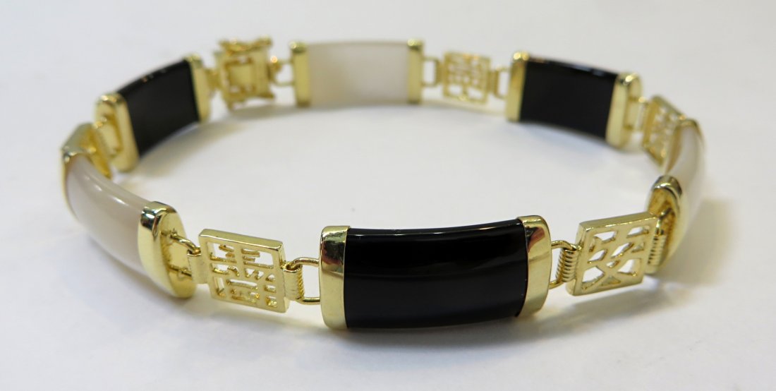 Bracelet: Made from black onyx, nacre within gold tone bindings. Shipping: We are able to pack and ship this item to an address in the United States for $15.00 via USPS Priority Mail. Tracking information will