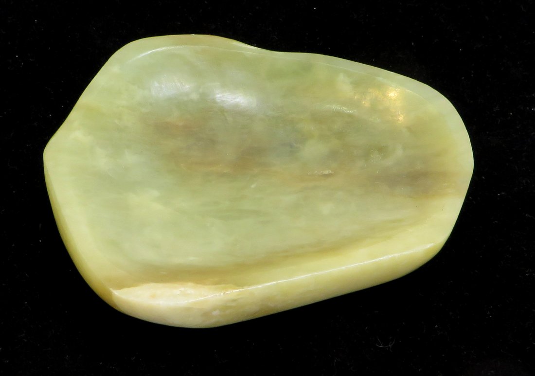 Jade Inkstone: An unusual free form like inkstone, 4 1/4" across. Shipping: We are able to pack and ship this item to an address in the United States for $25.00 via USPS Priority Mail. Tracking information will be s
