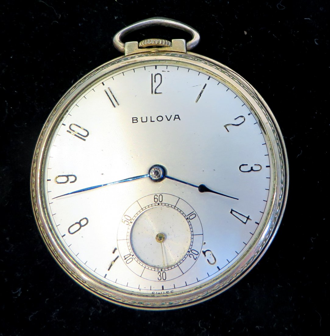 Bulova Pocket Watch: A gold filled cased open faced Bulova dress watch with a jeweled movement. The case is lacking the glass crystal, but the dial without noticeable damage or wear. Shipping: We are able to pack and ship