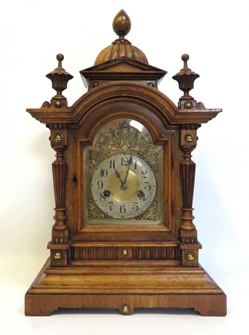 Victorian Mantel Clock By Jughans: A nice looking 21" walnut mantel clock by Jughans of Germany with a double gong quarter hour strike and a brass and silvered dial. Shipping: We are unable to ship this item. Please contact our local U