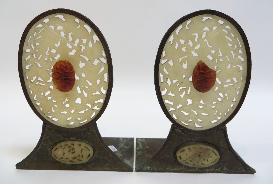 Pair Of Jade & Agate Book Ends: An unusual pair, each 7", with hammered copper bases and oval mounted white hard stone pierced ovals and with centrally mounted red hardstone carved ovals. Shipping: We are able to pack and ship this 
