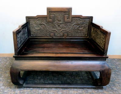 Zitan Wood Throne Chair: A carved throne chair which, among collectors of Chinese furniture, is considered the highest form of chair. Only emperors were permitted to sit in it. Most were made in the middle of the Qing Dynasty