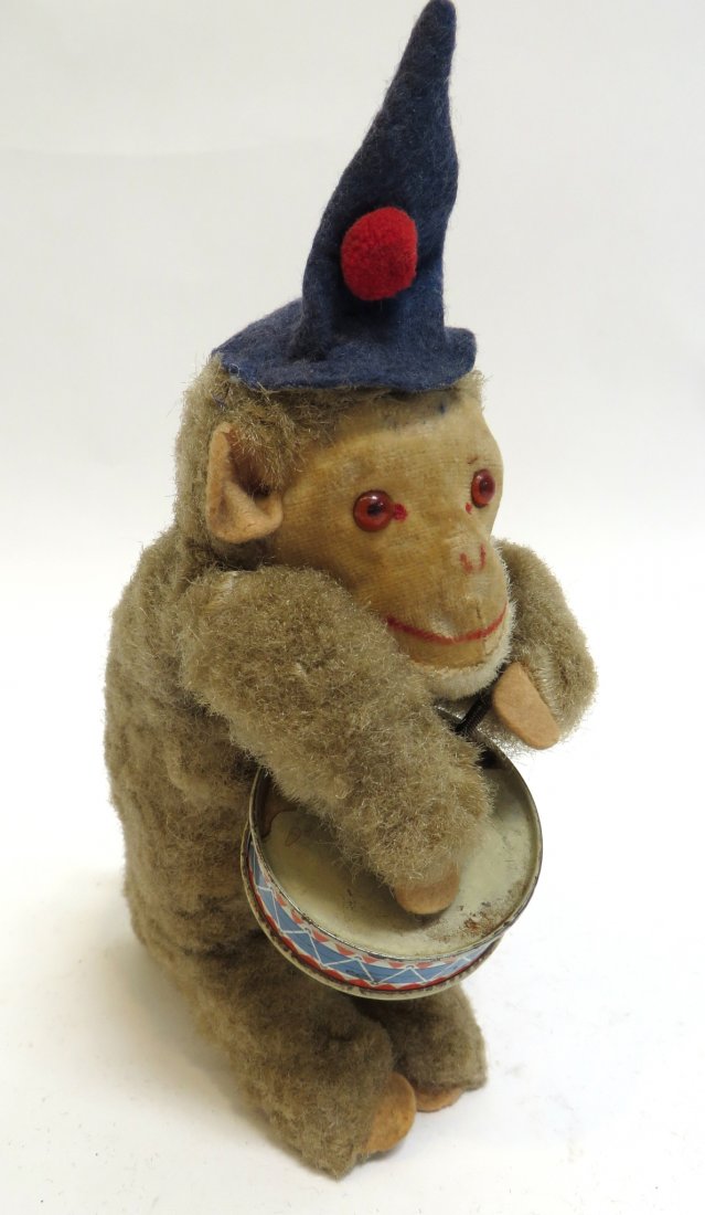 Wind Up Wizard Monkey With Drum: 7" tall, works imperfectly. . Shipping: We are able to pack and ship this item to an address in the United States for $30.00 via USPS Priority Mail. Tracking information will be sent to your email add
