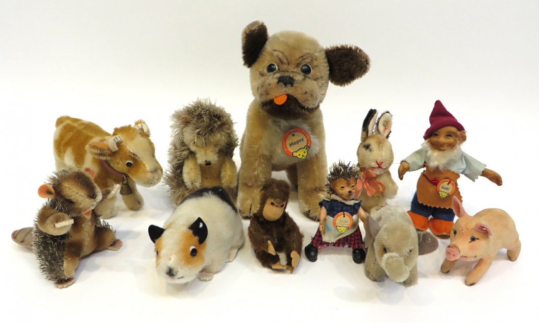 Collection Of Steiff: Eleven Steiff items including animals such as beaver, dog, cow, pig, etc and two figures, Gucki and Micki. Tallest is 8". Shipping: We are able to pack and ship this item to an address in the United S