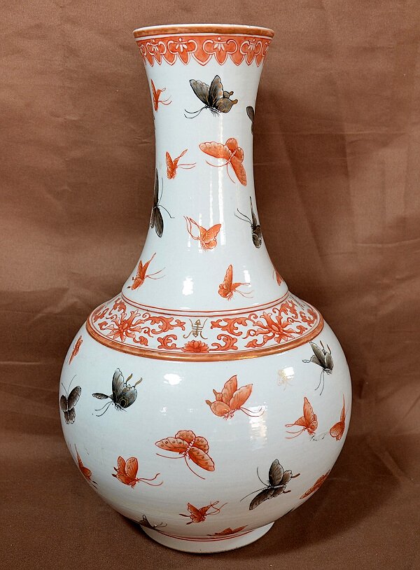 Chinese "Hundred Butterflies" Vase: A 19th century bottle vase with the Guangxu seal mark on base. 16" Shipping: We are able to pack and ship this item to an address in the United States for $55.00 via USPS Priority Mail or via FedEx Gr