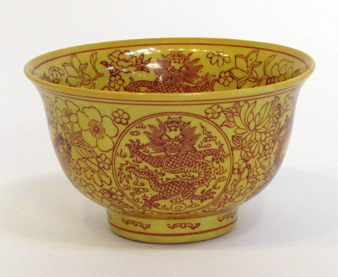 Yellow Chinese Dragon Bowl: A Chinese dragon bowl, 4 7/8" X 2 7/8". Line decoration with red iron oxide over yellow glazes. Marked on the bottom. Shipping: We are able to pack and ship this item to an address in the United State