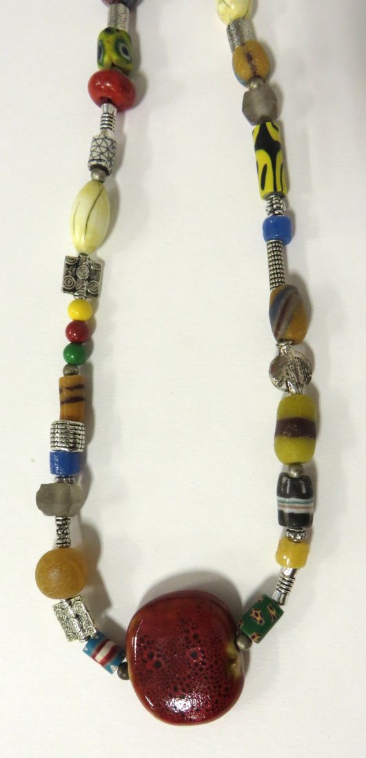 Jane Ruddell Design Jewelry: Made from a variety of glass and beaded devices Shipping: We are able to pack and ship this item to an address in the United States for $25.00 via USPS Priority Mail. Tracking information will be sent