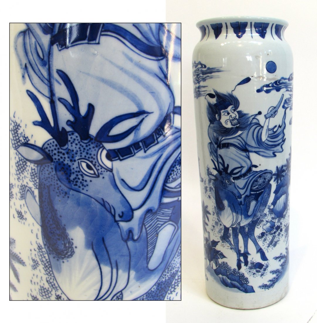 Chinese Vase: 17 1/4" tall Blue & White cylindrical vase with an interesting warrior/ servant , reindeer scene. Possibly used as a small umbrella stand. Shipping: We are able to pack and ship this item to an addres