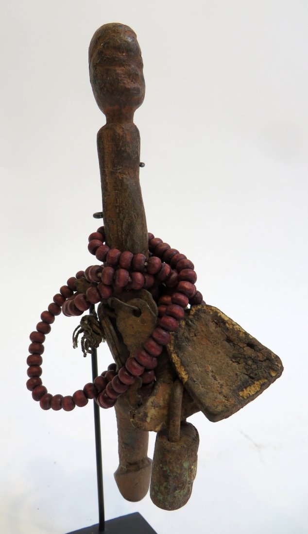 African Fon Fetish: Constructed of found objects, including carved wood, padlocks, etc. Believed to have powers to protect from evil or misfortune. Most come from Africa's west coast, Benin. Eight inches in overall heigh