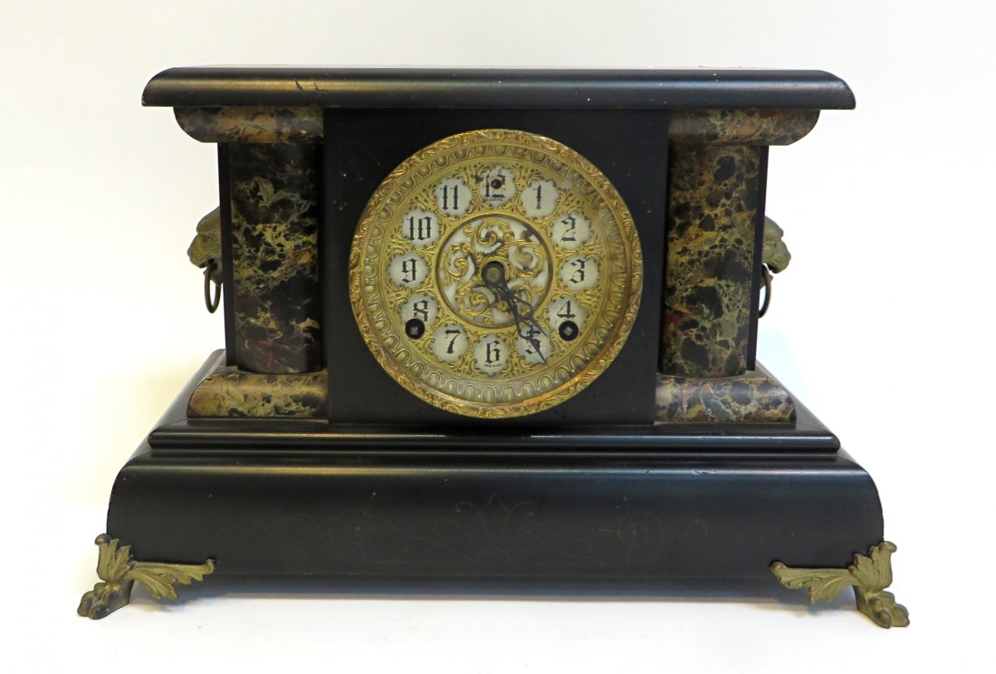 E. N. Welch Co., "Camilla Urso" Clock: With an ebonized and faux marble case with applied castings, featuring an eight day striking clockworks. Dial marked Sessions Clock Company. American. 11" X 17" Shipping: We are able to pack and ship