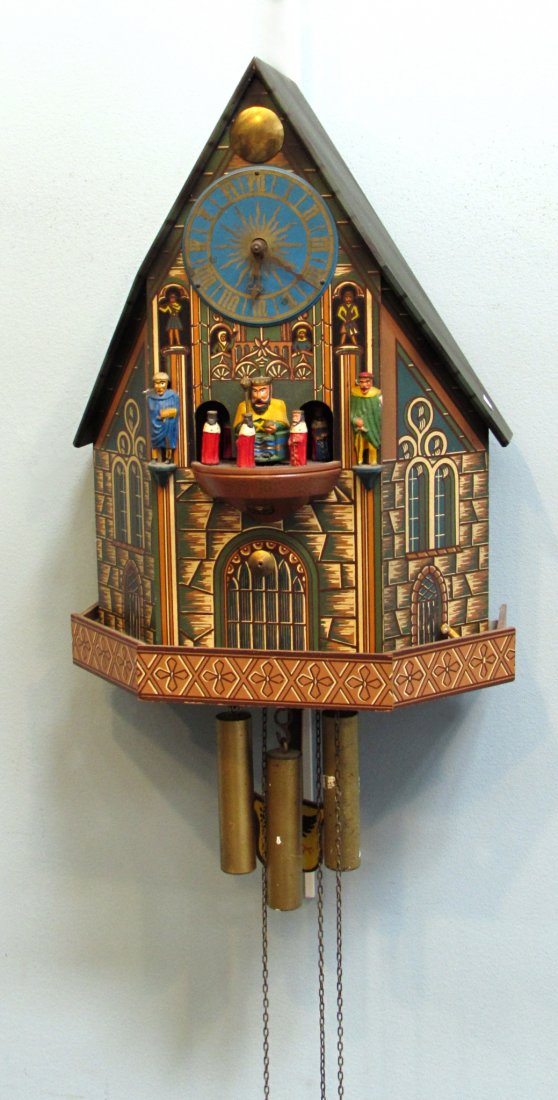Chalet Style Cuckoo Clock: In the form of a painted Mediaeval European building with automation . Three weights. Shipping: We are able to pack and ship this item to an address in the United States for $50.00 via USPS Priority M