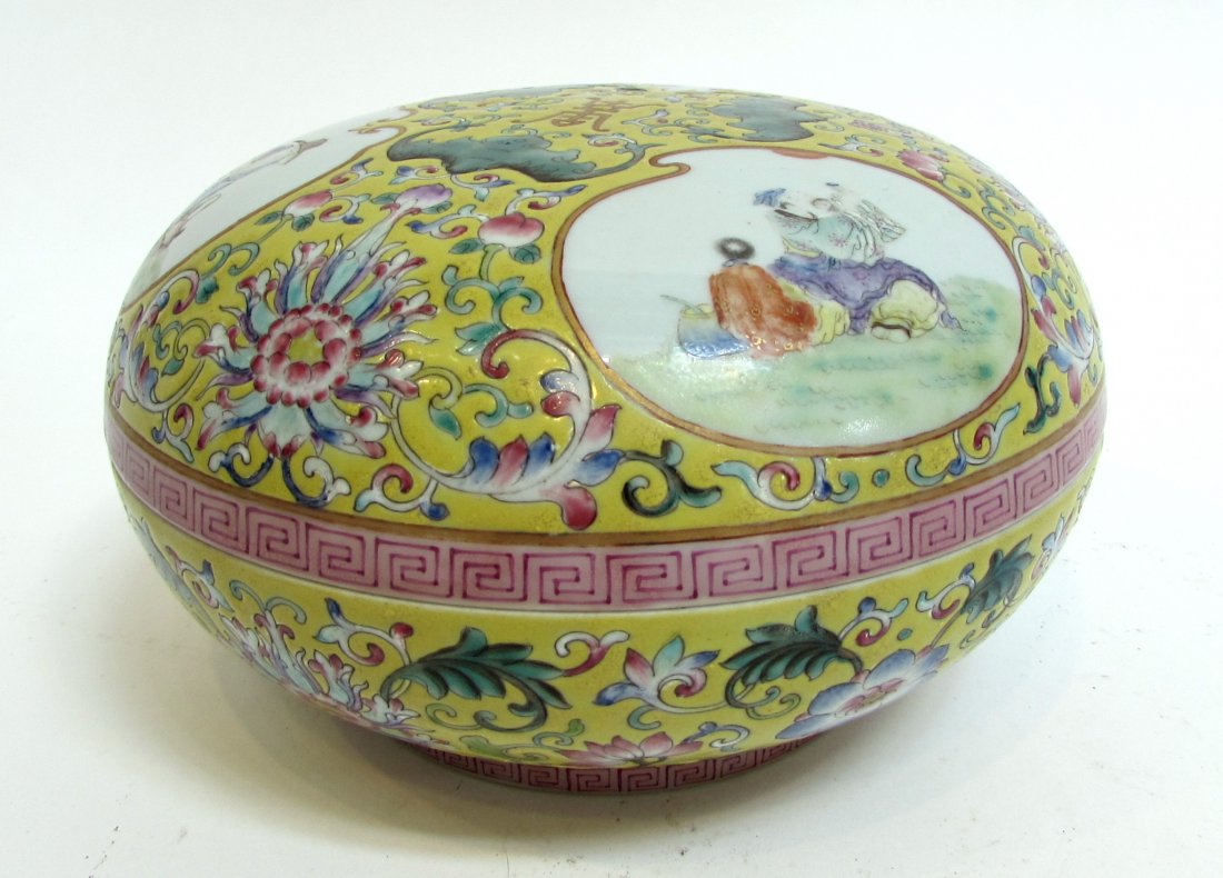 Qianlong Style Lidded Dish: A 3 3/4" X 6 1/2" lidded round porcelain candy dish in Wucai. Reserves with figural depictions. Shipping: We are able to pack and ship this item to an address in the United States for $30.00 via USPS