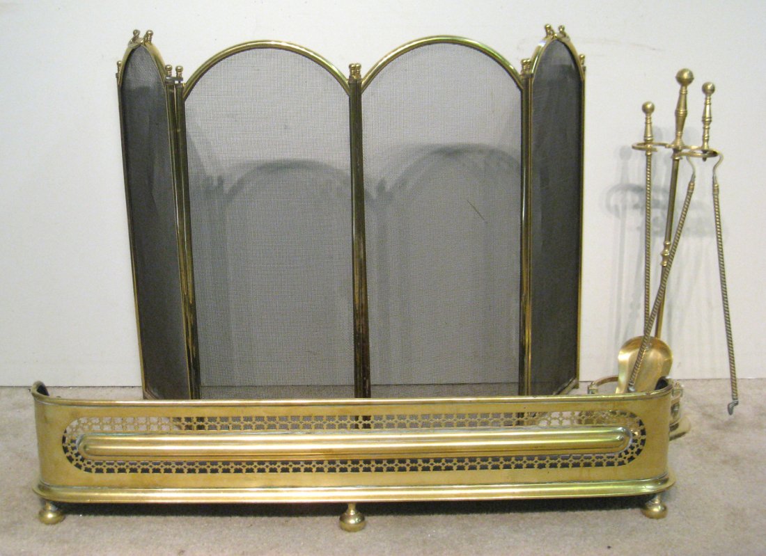 Fireplace Screen: A hinged four piece screen with brass frame and handles, Three piece fireplace utensils, and a 42" X 9" pierced brass fender with ball feet. Shipping: We are unable to ship this item. Please contact a