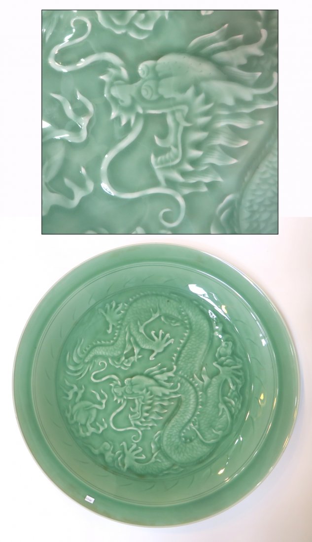 Dragon Embossed Celadon Charger: An impressive green celadon charger with a bottom mark, as shown, and featuring a raised and impressed with a five clawed dragon. 23" Shipping: We are unable to ship this item. Please contact a third 