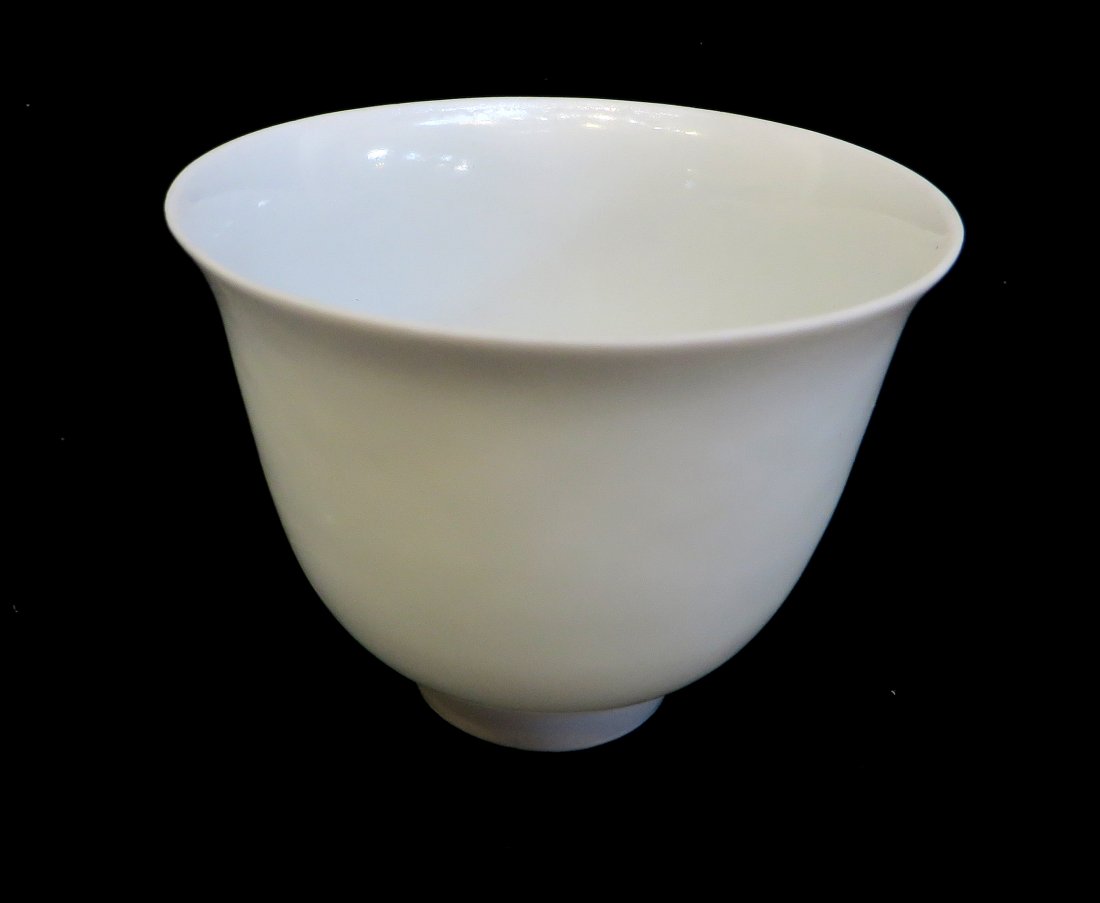 Fine White Embossed Eggshell Cup: A porcelain cup, translucent with light revealing dragons, etc along the sides, 1 3/4" Shipping: We are able to pack and ship this item to an address in the United States for $25.00 via USPS Priority 