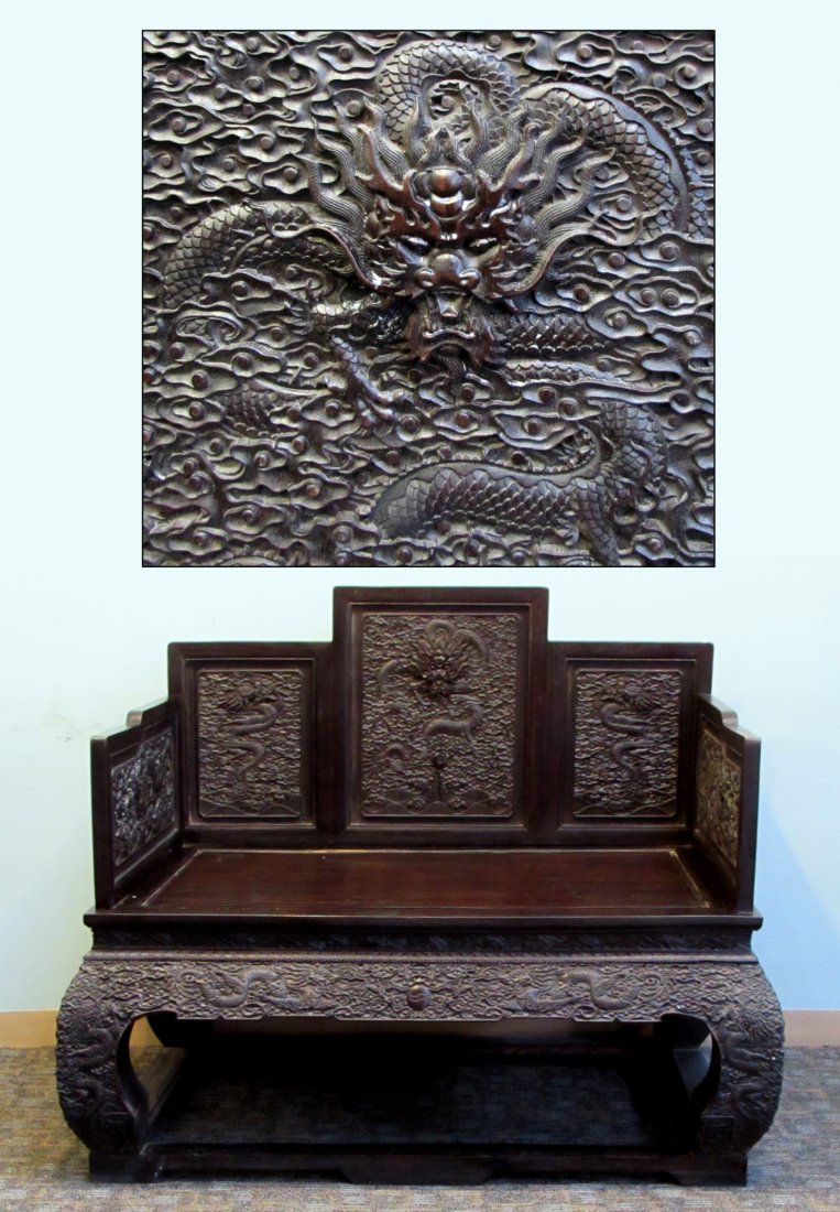 Qing Chinese Zitan Throne Chair: A Chinese Qing era throne chair 42" X 50" X 35" featuring outstanding carved panels: three on the backrest, one on each side of the armrests, as well along the skirts and legs. The carvings are busy w