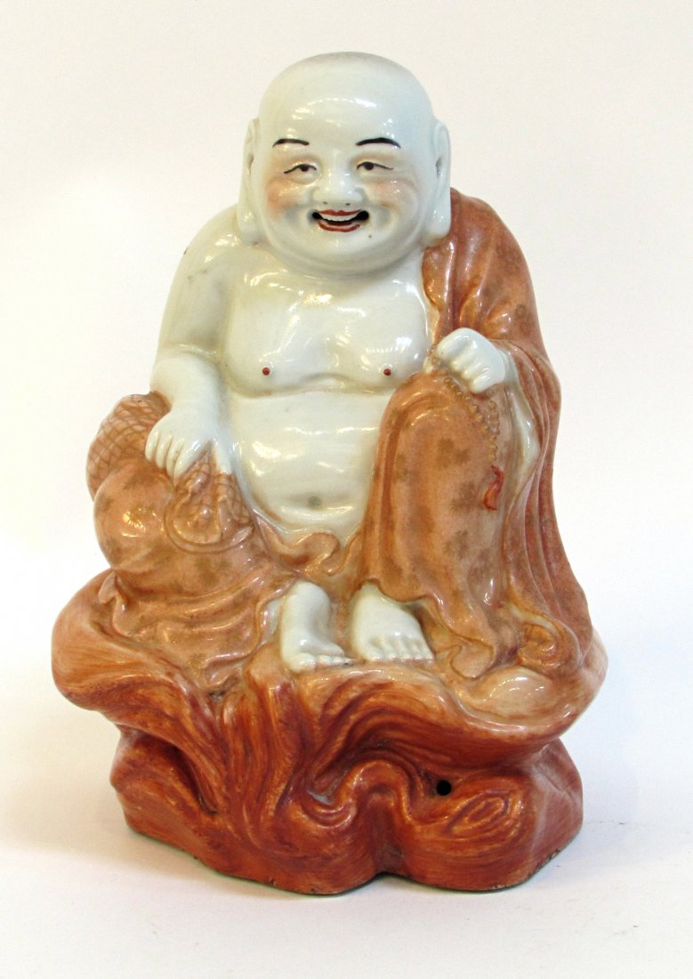 Ceramic Chinese Buddha: 7 3/4" in height in mostly sunset red glaze showing a happy Buddha in porcelain Shipping: We are able to pack and ship this item to an address in the United States for $40.00 via USPS Priority Mail or