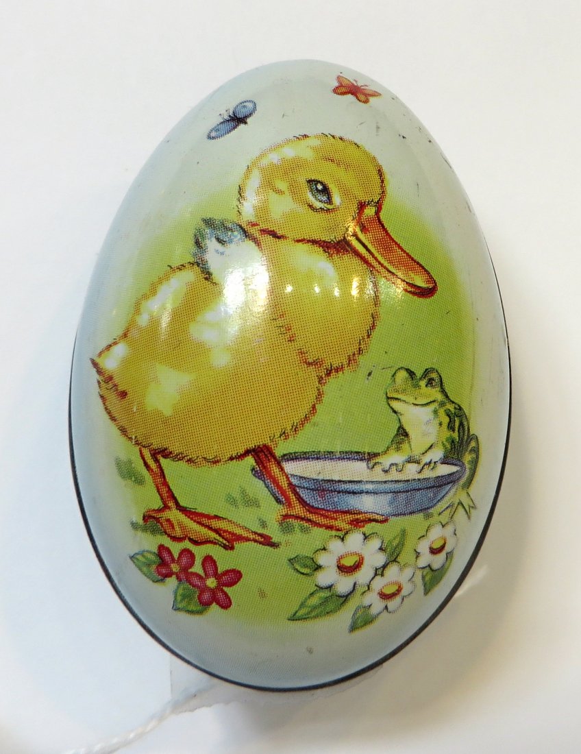 Vintage Irish/English Tin Candy Egg Container: Very old item. 2" long. An antique confectionary container made out of tin. Definitely an Easter Egg. Confectionary made in Irleland exclusively for Biscon Imports Ltd. Container made in England. Desi
