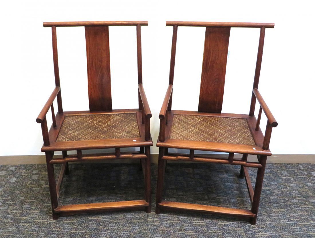 Pair Of Huang Hua Li Yoke Back Chairs.: Each 44 1/2" in height, with caned seat covers and straight back rest tops. Shipping: We are unable to ship this item. Please contact a third party shipper for a quote. Please be sure and include your