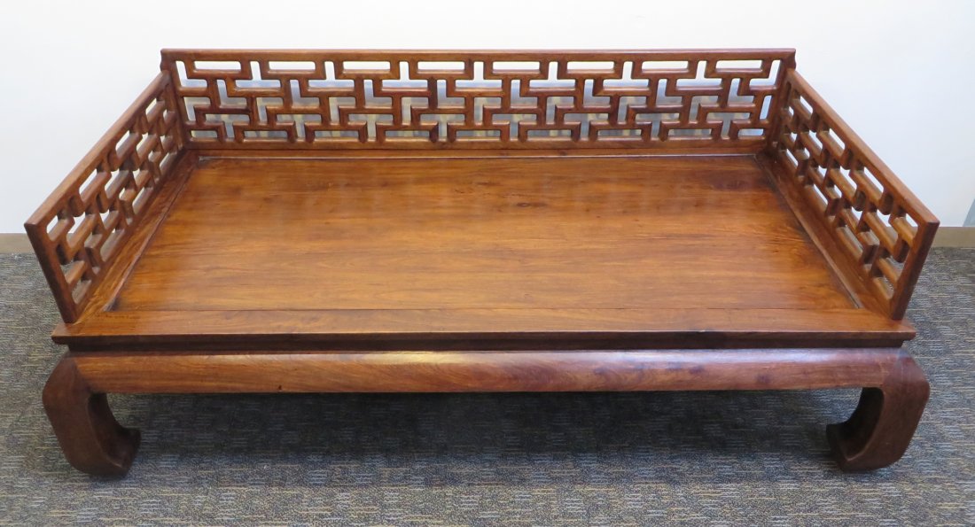 Huang Hua Li Bed: A Huang Hua Li bed with three sided pierced fencing, as seen. 18" X 83" x 44" Shipping: We are unable to ship this item. Please contact a third party shipper for a quote. Please be sure and include yo
