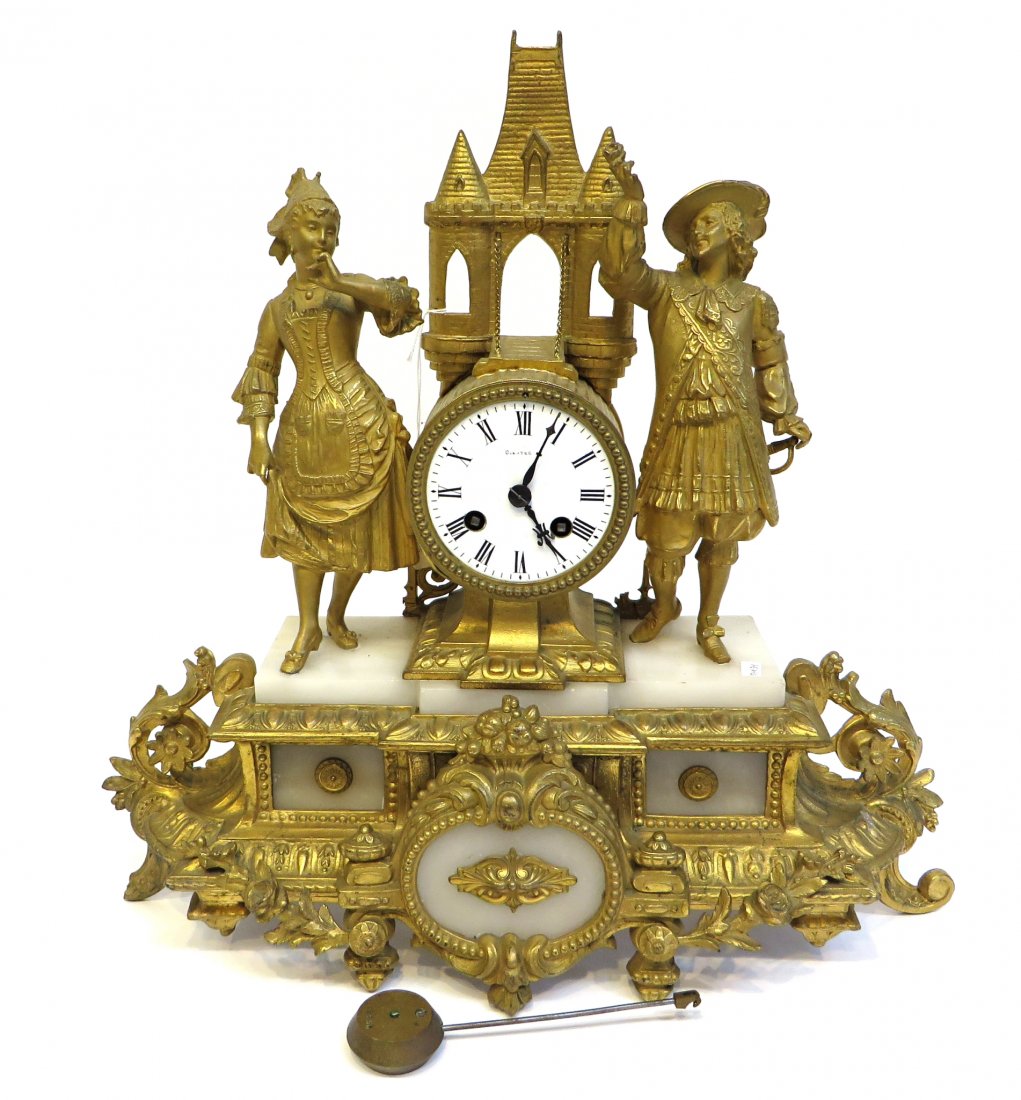 Mid 19th C. French Made Clock: Gilt metal and white marble mantel clock from the mid 19th C., 16" Shipping: We are able to pack and ship this item to an address in the United States for $55.00 via USPS Priority Mail or via FedEx Gr