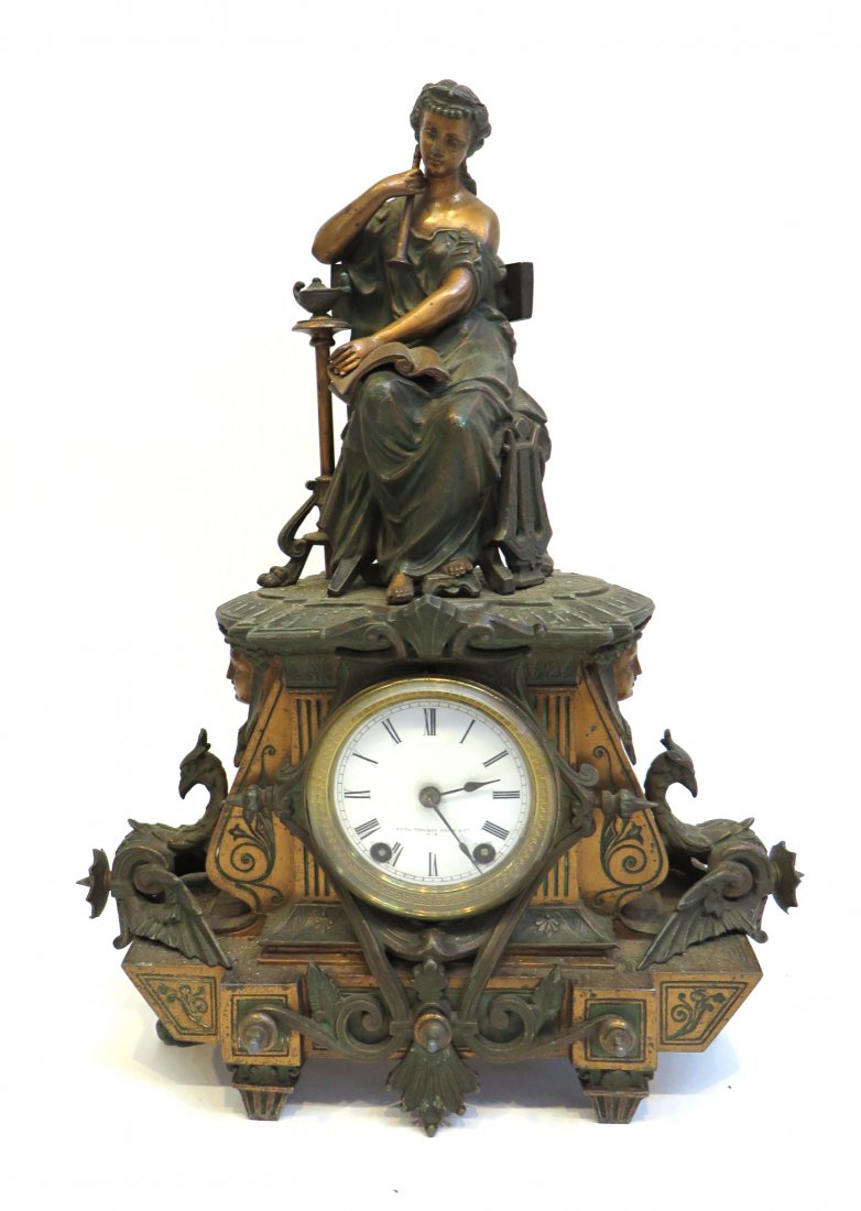Seth Thomas American Mantel Clock: A rare mantel clock made by Seth Thomas, second half of the 1800s, to imitate the style of European clocks. Cast metal polychrome case complete with Victorian images of Griffins, caryatids, etc. 18" S