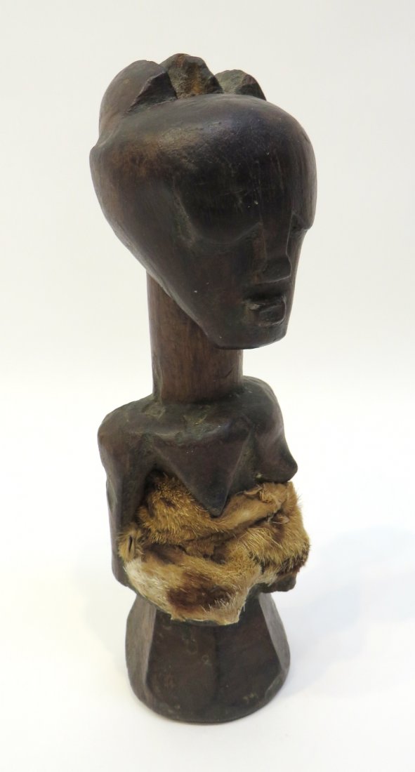 Wood And Animal Skin African Fetish Doll: A 7 1/2" carved wood female figure made if wood and animal skin. Shipping: We are able to pack and ship this item to an address in the United States for $30.00 via USPS Priority Mail. Tracking informa