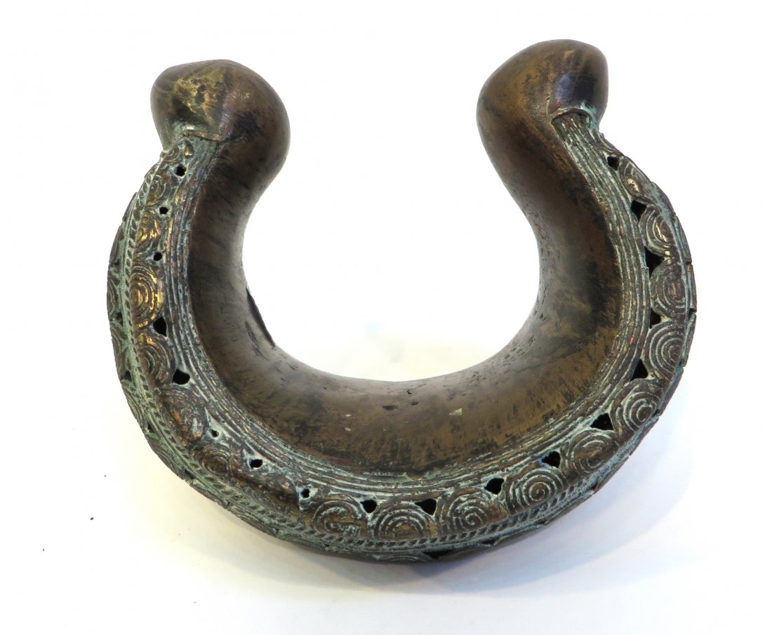 Antique African Dan Bracelet: A hollow cast African currency bracelet possibly Liberia, ca 1900. 23.4 OzT., 6" across. Shipping: We are able to pack and ship this item to an address in the United States for $30.00 via USPS Priorit