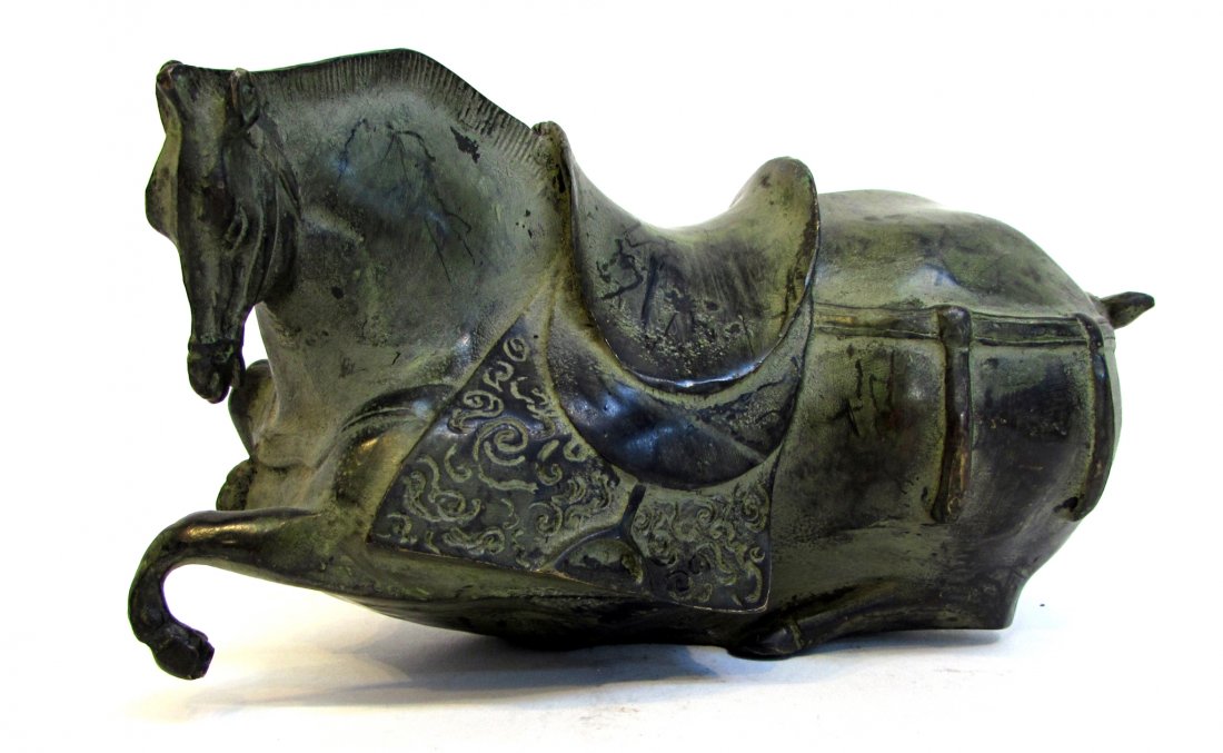 In The Tang Style: The Fat Horse: In patinated bronze, the horse, off his feet with a saddle. Shipping: We are able to pack and ship this item to an address in the United States for $30.00 via USPS Priority Mail. Tracking information 